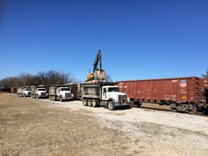 Unloading Rail Gondola into Dump Trucks
